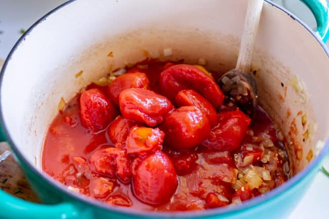 whole tomatoes in a pot for homemade tomato soup recipe.