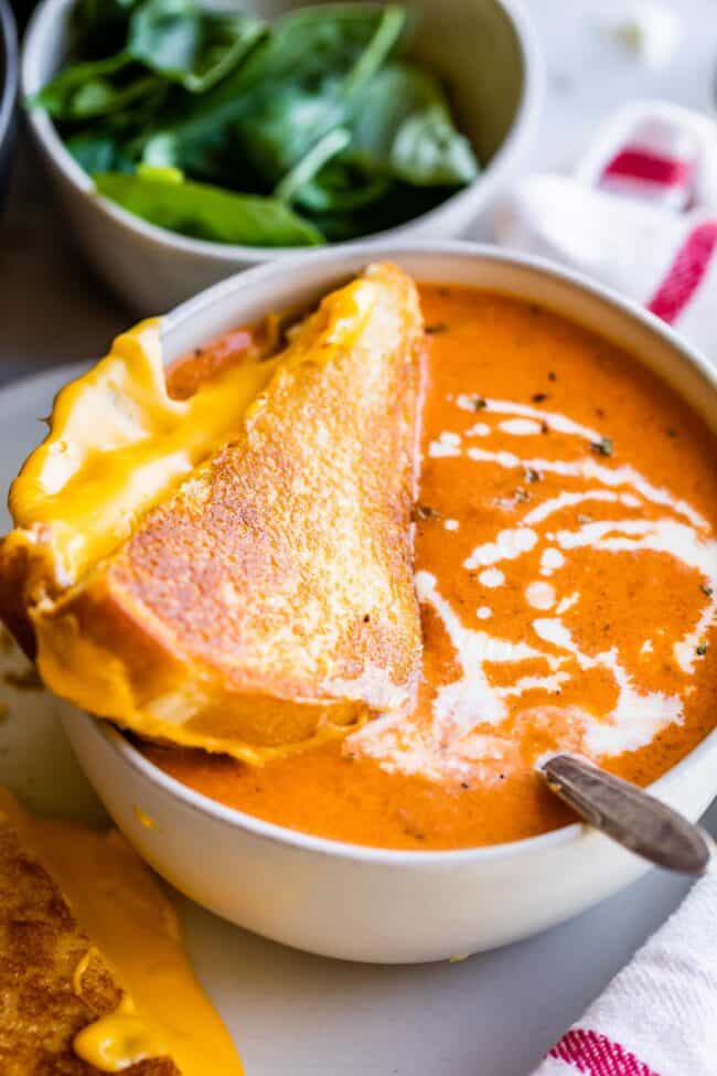 grilled cheese and tomato soup drizzled with cream.