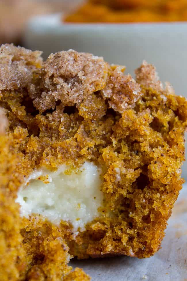 closeup of pumpkin muffins with cream cheese filling showing a moist crumb.