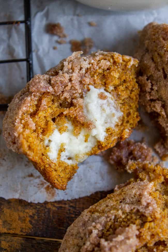 pumpkin cream cheese muffin split in half, shot from the side.