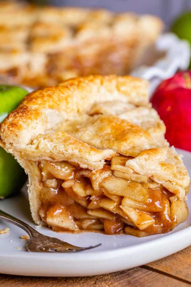classic apple pie recipe on a plate with a fork.