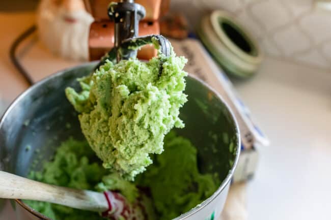 green cookie dough for cookies in a stand mixer