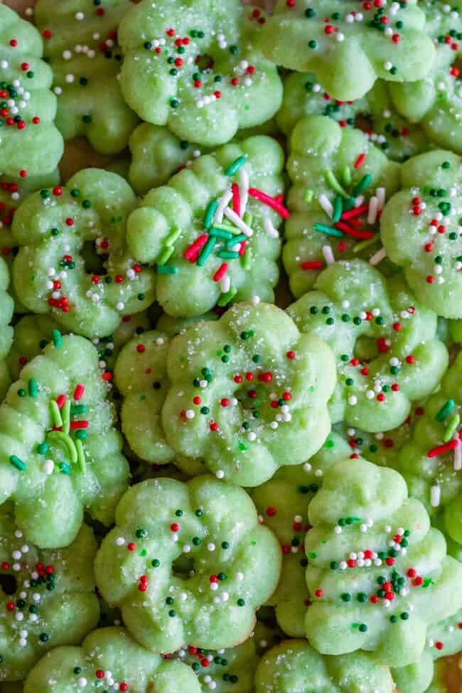 green almond spritz cookies in wreath and tree shape