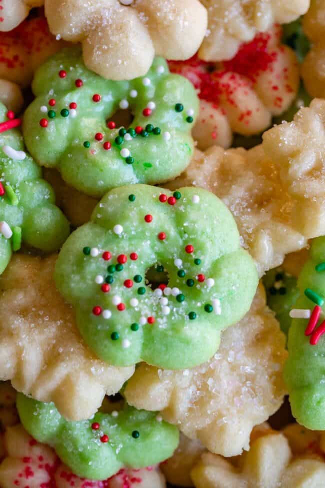 buttery spritz cookies in a wreath shape with sprinkles.