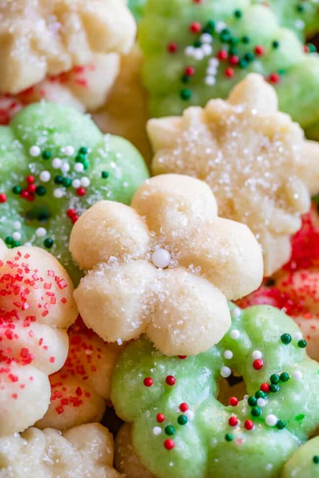 green and white spritz cookies with red, white, and green sprinkles.