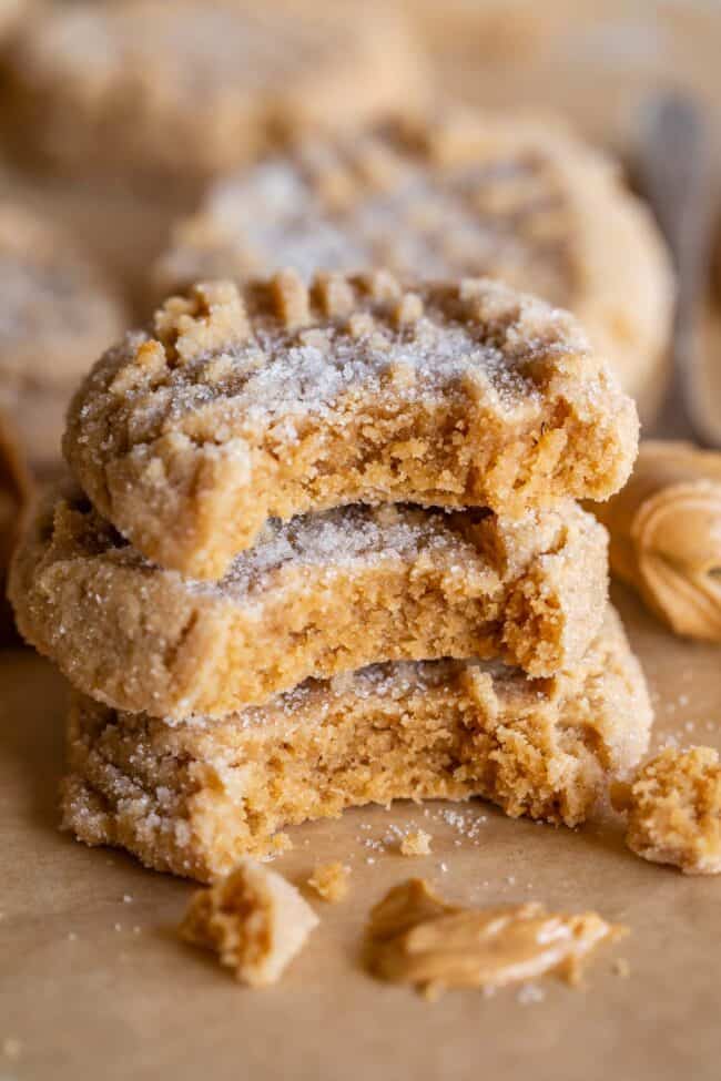 stack of 3 soft peanut butter cookies, each with a bite taken out.