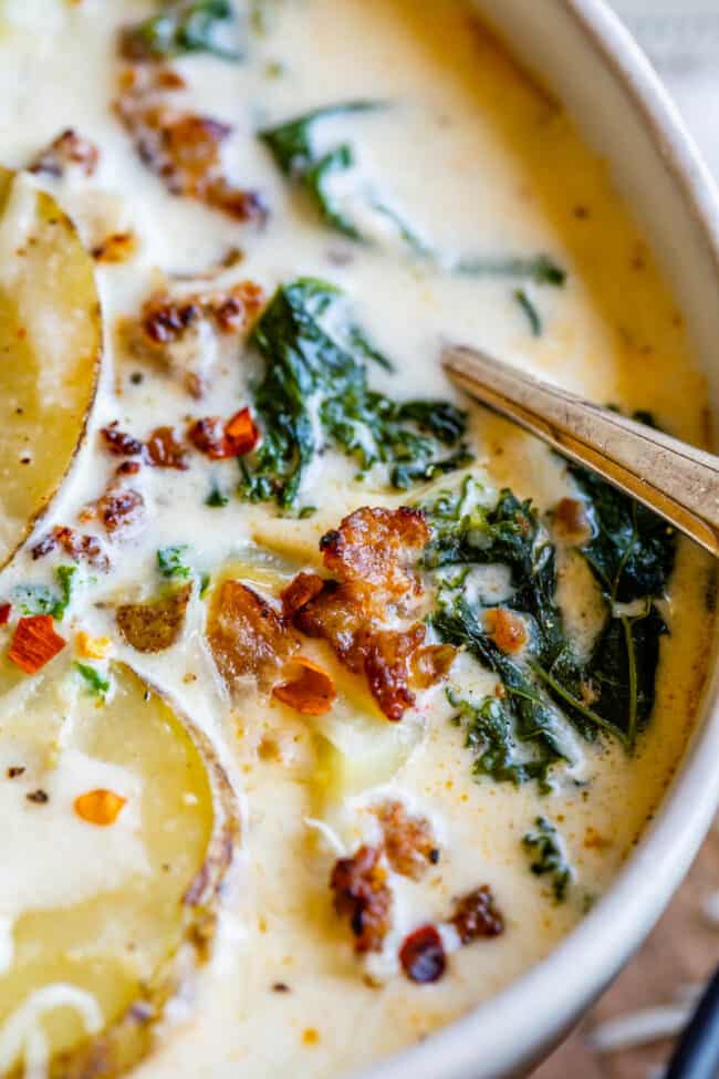 Olive Garden Zuppa Toscana in a white bowl with sausage and kale 