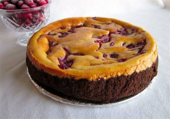 Whole cranberry cheesecake with chocolate graham cracker crust.