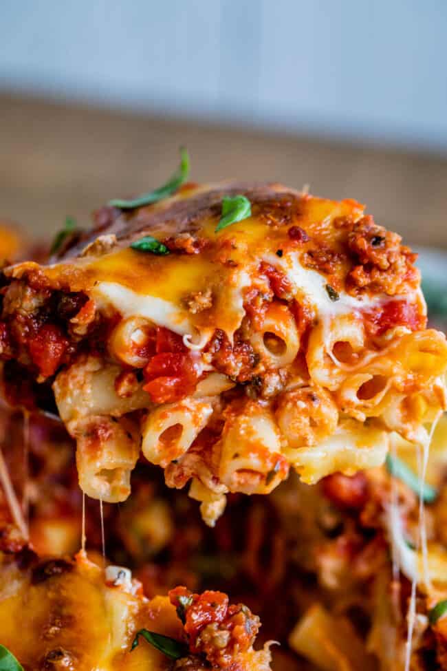 a piece of baked ziti with stretchy melted cheese.