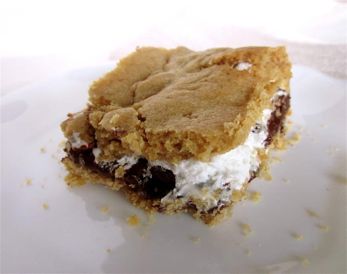 Cookie crusted s'mores bar on a plate.