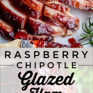 Close-up of sliced baked ham coated in a glossy, dark red raspberry chipotle glaze, garnished with fresh herbs. Text overlay reads “Raspberry Chipotle Glazed Ham.”.