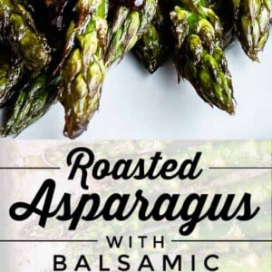 Close-up of oven roasted asparagus spears drizzled with balsamic brown butter, alongside a spoon of brown butter. Text reads: Roasted Asparagus with Balsamic Brown Butter.