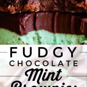 Close-up of fudgy mint brownies with a thick layer of mint cream, topped with smooth chocolate icing. The brownies are sliced to reveal rich, dense layers and a creamy green mint filling.