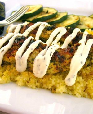 Pesto Chicken with Italian Cream Sauce over Parmesan Couscous from TheFoodCharlatan.com