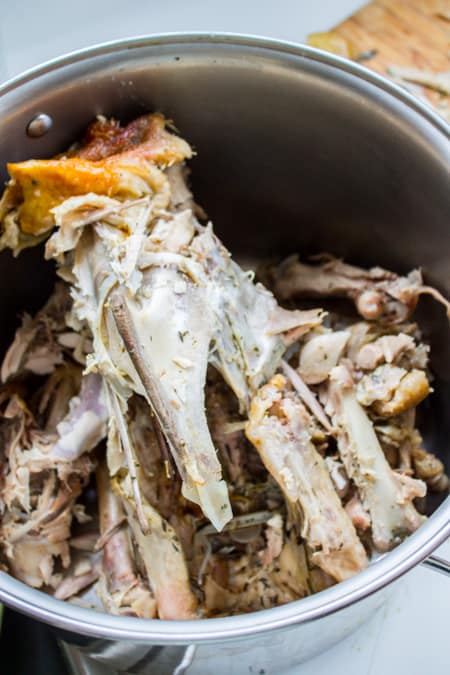 turkey carcass inside pot for turkey bone broth recipe