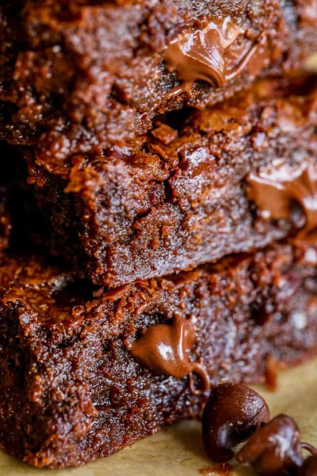 a stack of gooey, chocolately brownies shot up close.