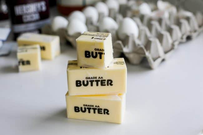 stack of butter sticks in front of eggs.