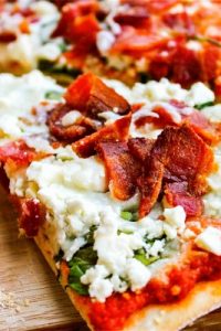 Spinach, Bacon, & Feta Pizza with Sun-Dried Tomato Sauce from The Food Charlatan