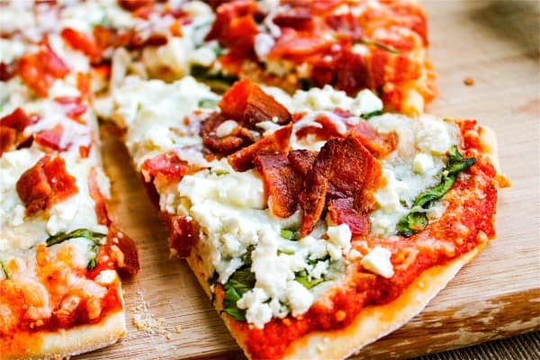 Spinach, Bacon, & Feta Pizza with Sun-Dried Tomato Sauce from The Food Charlatan