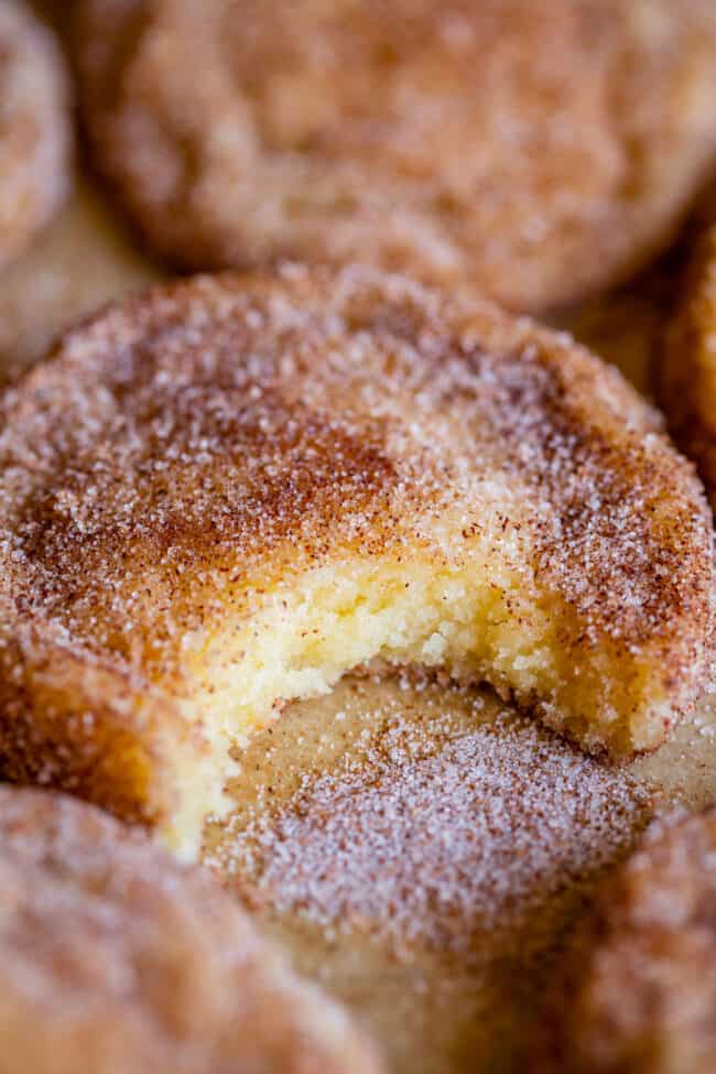 easy snickerdoodle recipe with extra cinnamon sugar and a bite taken out