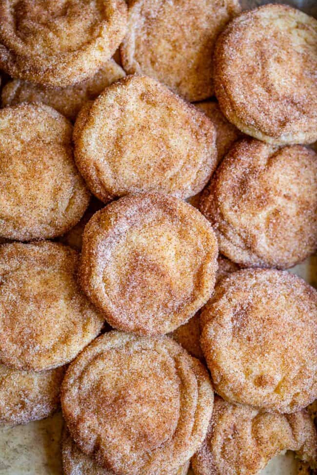 snickerdoodle cookies spread out on a pan.