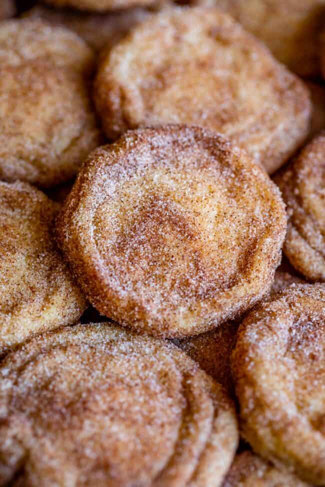 snickerdoodles stacked up on a pan.