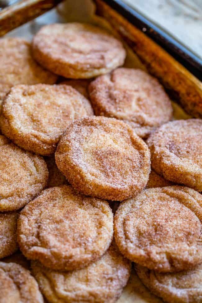 snickerdoodle cookies spread out on a pan.