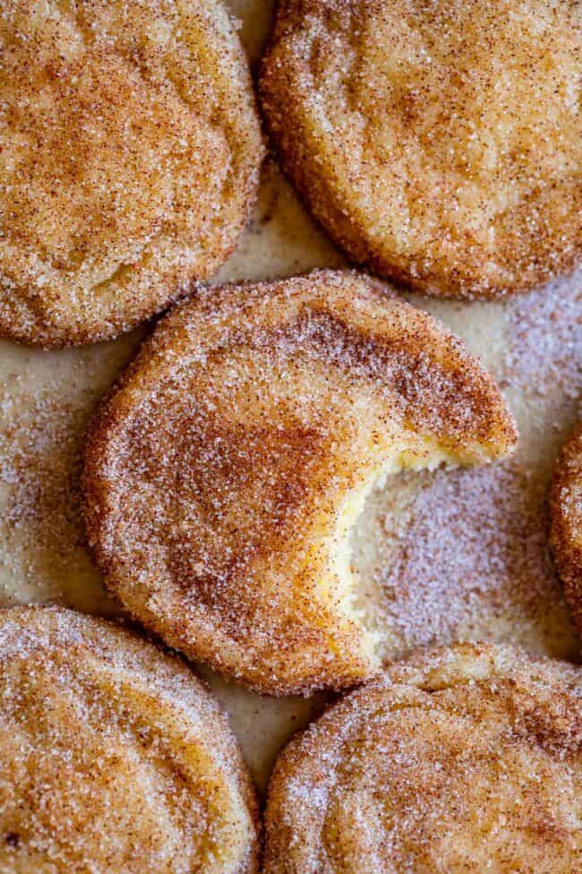 snickerdoodle cookies shot from overhead with a bite taken out.