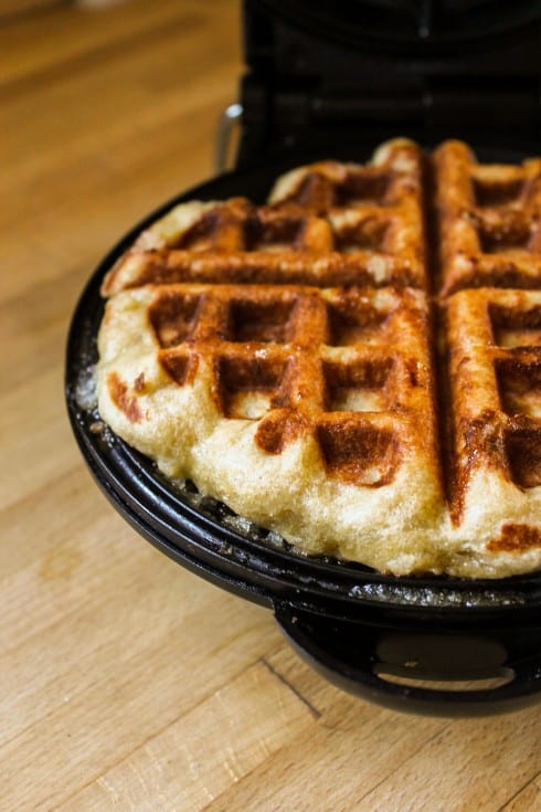 cooking a liege waffle in a waffle iron.