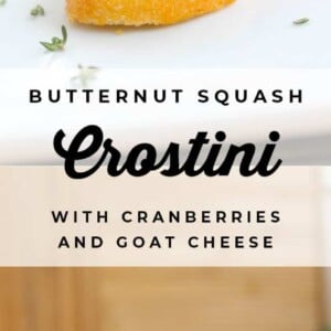 Crostini topped with goat cheese, roasted butternut squash, cranberries, and herbs are arranged on a white plate. The text reads: Butternut Squash Bruschetta with Cranberries and Goat Cheese.