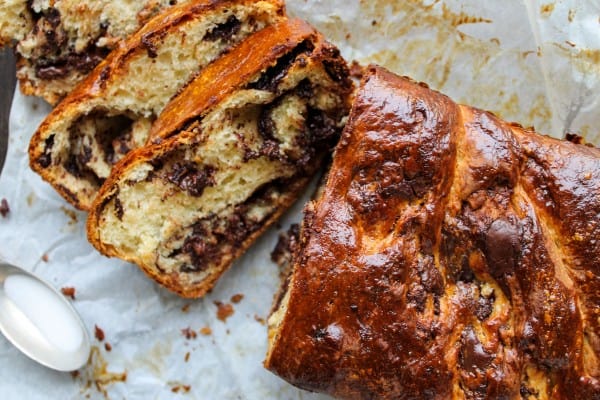 chocolate babka on parchment cut in slices.