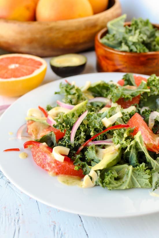 kale and grapefruit salad in front of fruit