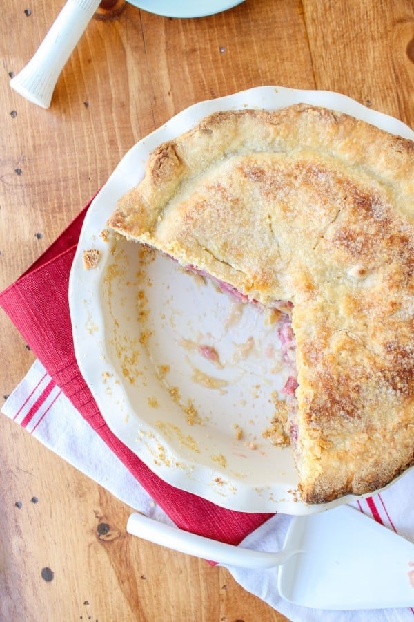 a rhubarb custard pie with part of it missing. 