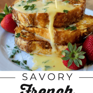 Stacked slices of savory Parmesan French toast are topped with chopped herbs and surrounded by fresh strawberries. A creamy yellow sauce is being poured over the toast. Text below reads: Savory French Toast Breakfast. The Food Charlatan.