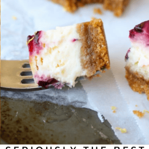 lemon blackberry cheesecake bars with a bite on a fork.