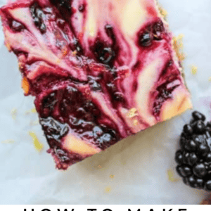 A close-up of a blackberry lemon bar with a marbled blackberry swirl on top, surrounded by fresh blackberries and a lemon slice. Text below reads Blackberry Lemon Bars – The Food Charlatan.