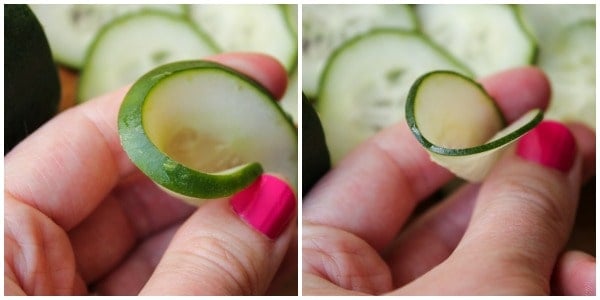 Example of thinly cut and thick cut cucumbers close up held by thumb and forefinger
