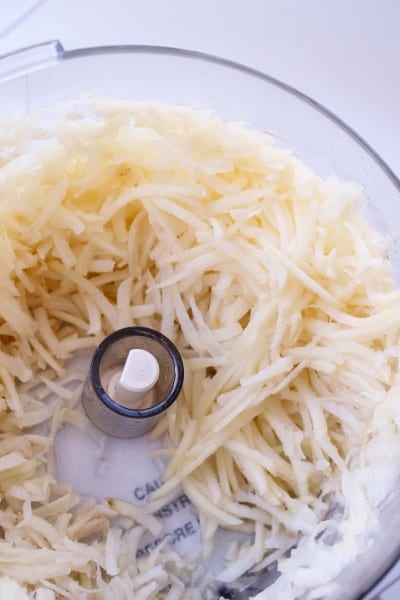 shredded potatoes in a food processor.