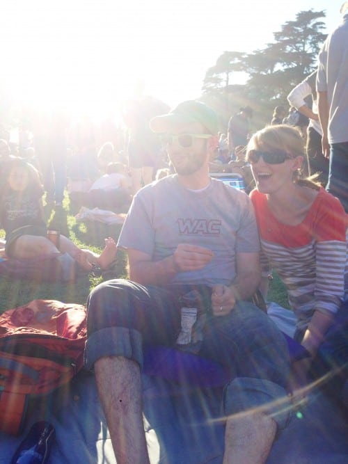 Couple at an outdoor concert.