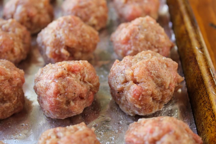 homemade meatballs ready to be baked in the oven. 