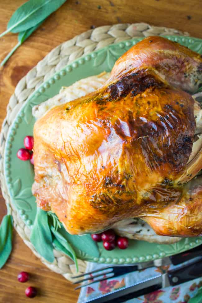 whole roast turkey on a green platter.