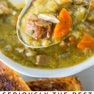A close-up of a spoonful of thick split pea soup with chunks of carrots, potatoes, and ham above a bowl, with toasted bread on the side. Text reads: Seriously Delicious Split Pea Soup, The Food Charlatan.