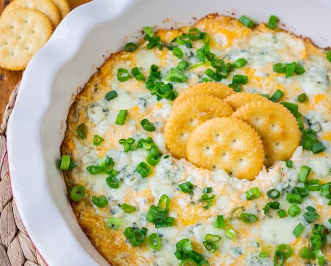 buffalo chicken dip with green onions and crackers