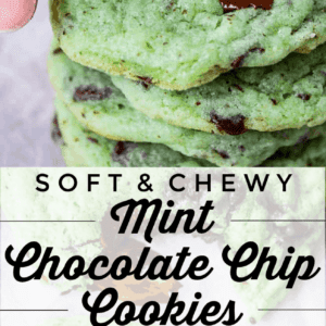 A hand holds a soft Mint Chocolate Chip Cookie above a stack of similar cookies. Text reads: Soft & Chewy Mint Chocolate Chip Cookies. Melted chocolate chips peek out from the cookies.