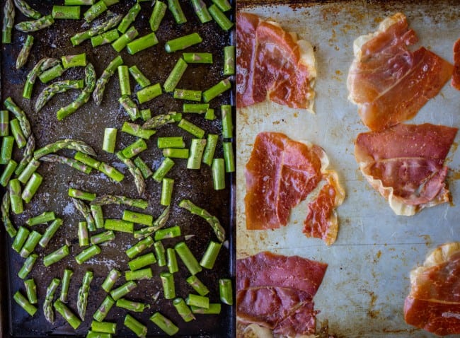 cut up asparagus on a baking sheet, crisped prosciutto on a baking sheet.