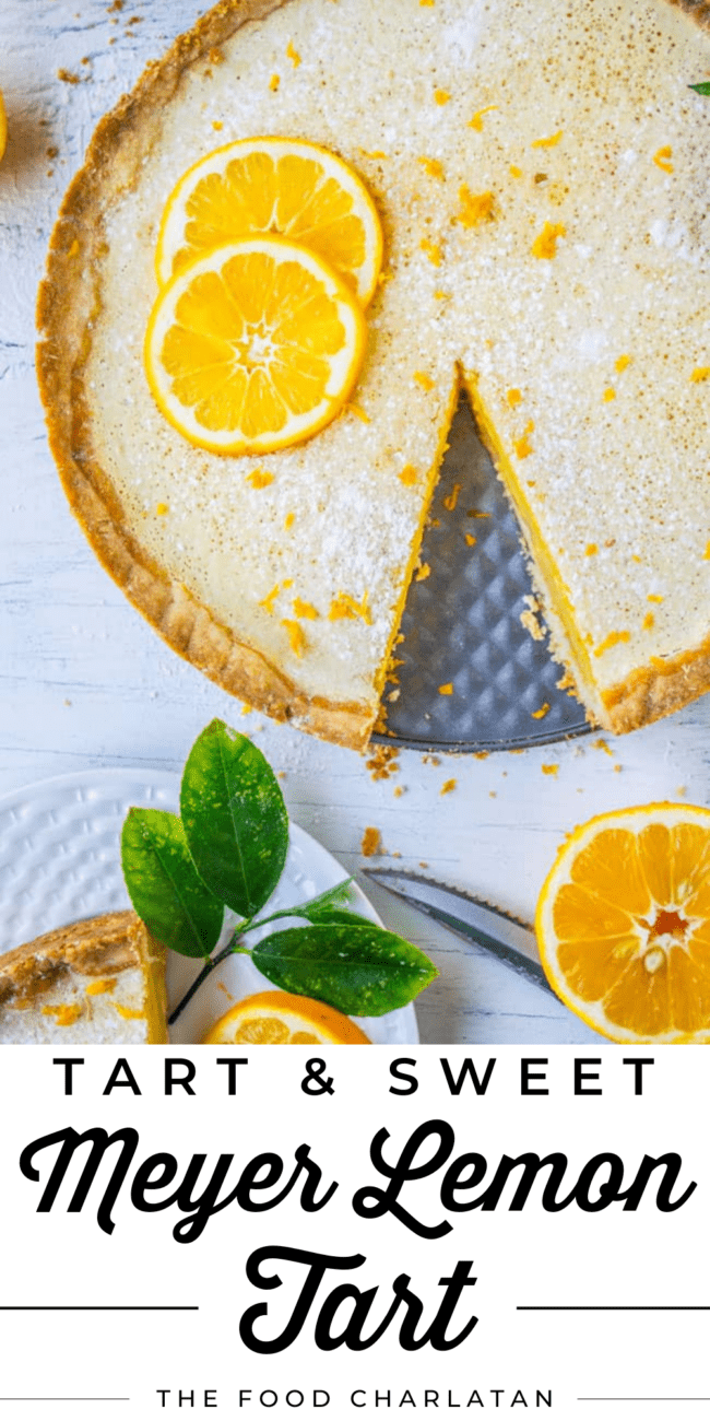 a meyer lemon tart with a slice cut out of it.