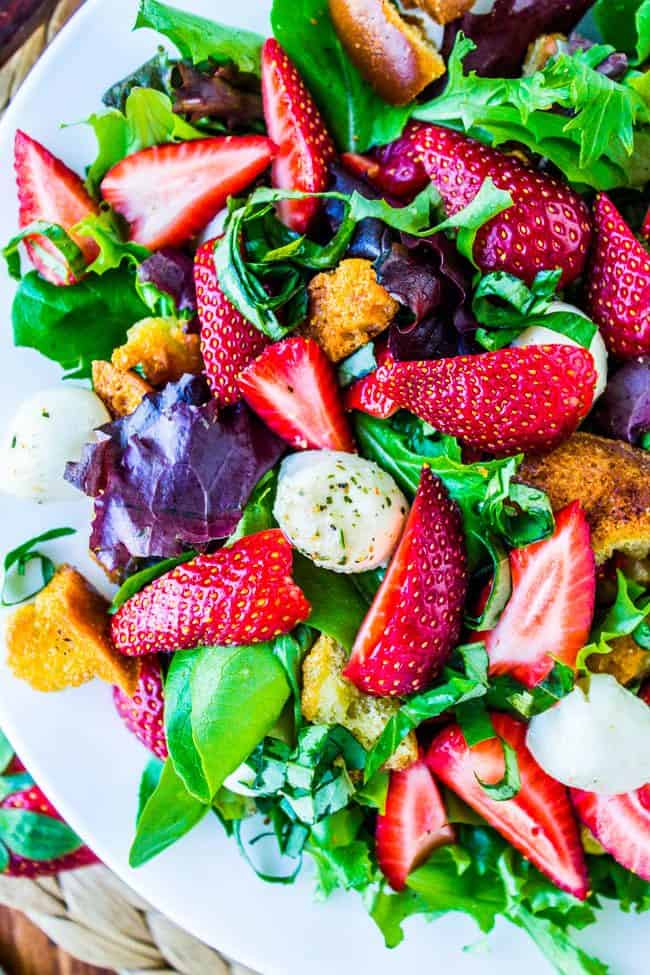 overhead shot of strawberry panzanella salad with crispy croutons.
