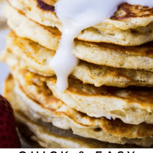 A stack of pancakes topped with coconut syrup, pineapple slices, and butter, with text reading Quick & Easy Coconut Syrup Like They Serve in Hawaii. The Food Charlatan.
