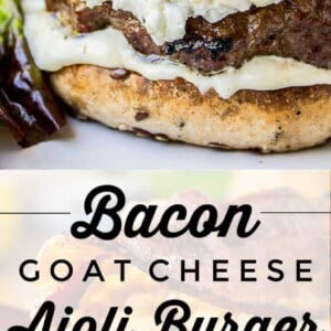 Close-up of a gourmet aioli burger on a seeded bun, topped with bacon, goat cheese, onion rings, and creamy aioli sauce, served with leafy greens. Text reads: Bacon Goat Cheese Aioli Burger.