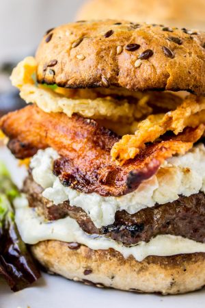 Bacon and Goat Cheese Aioli Burger with Crispy Onions from The Food Chatrlatan